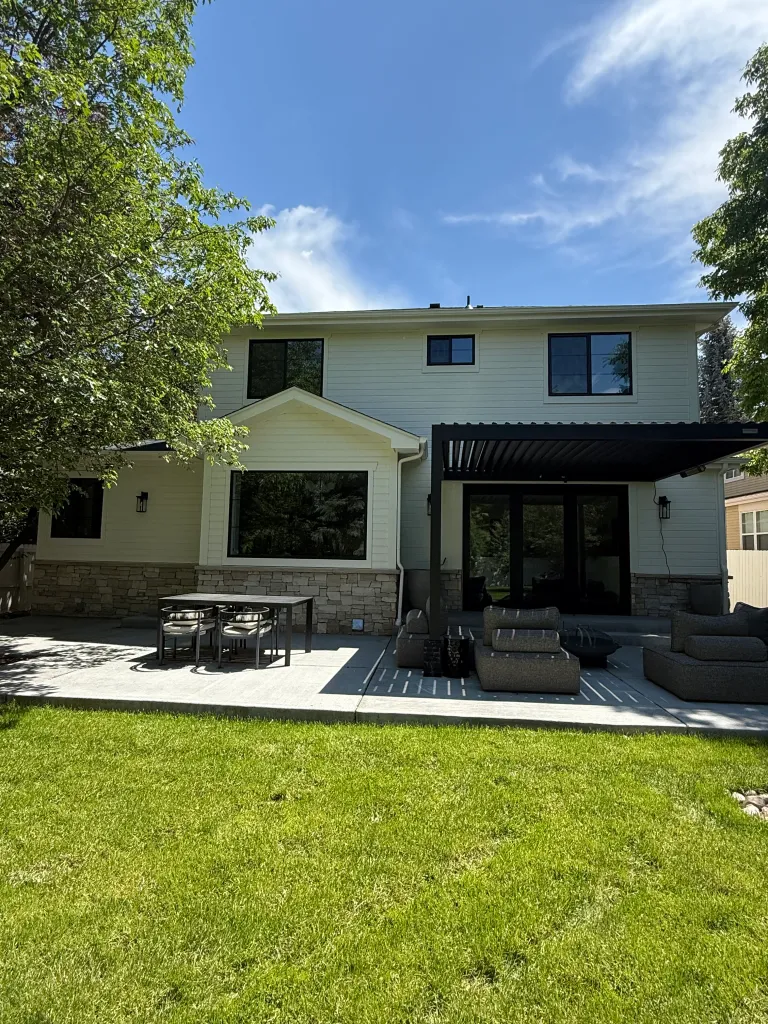 Beautiful home exterior with garden and trees